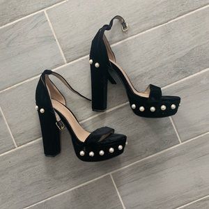 Pair of black and pearl velvet heels